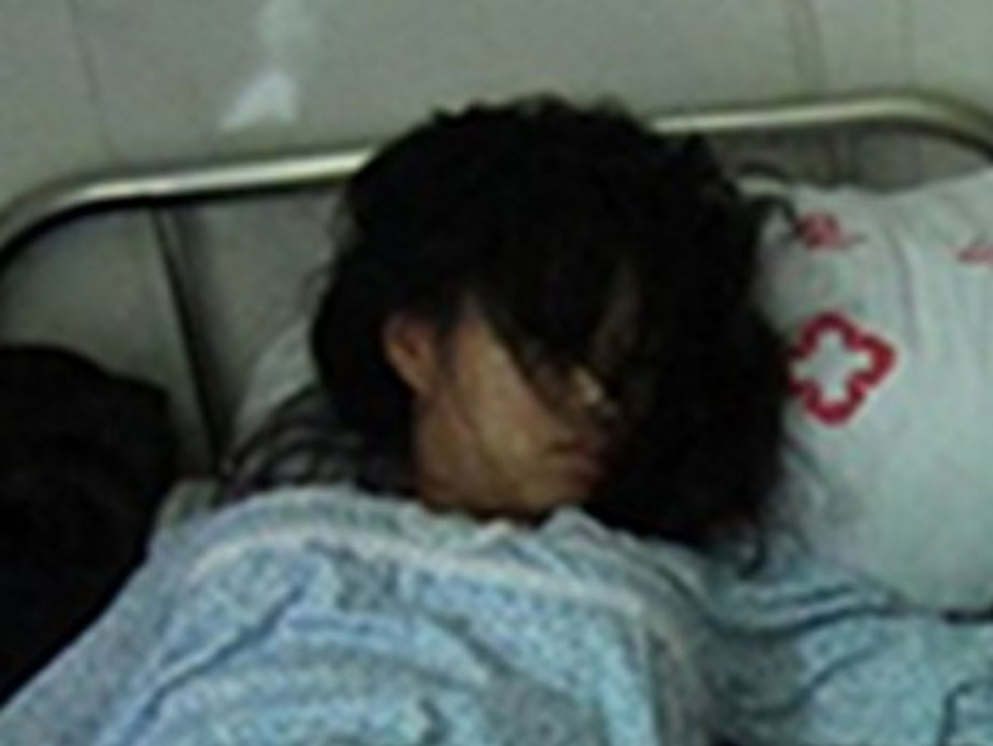 A detail of the photo of Feng Jianmei alongside her aborted fetus