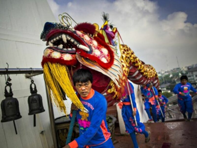 A dragon parade marks the start of the Wat Saket temple fair in Bangkok