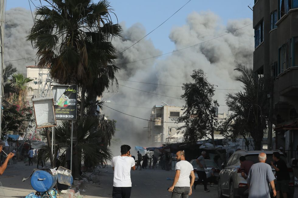 A dust or smokestorm rises as the sky is becoming covered and some people looking for shelter while others keep standing