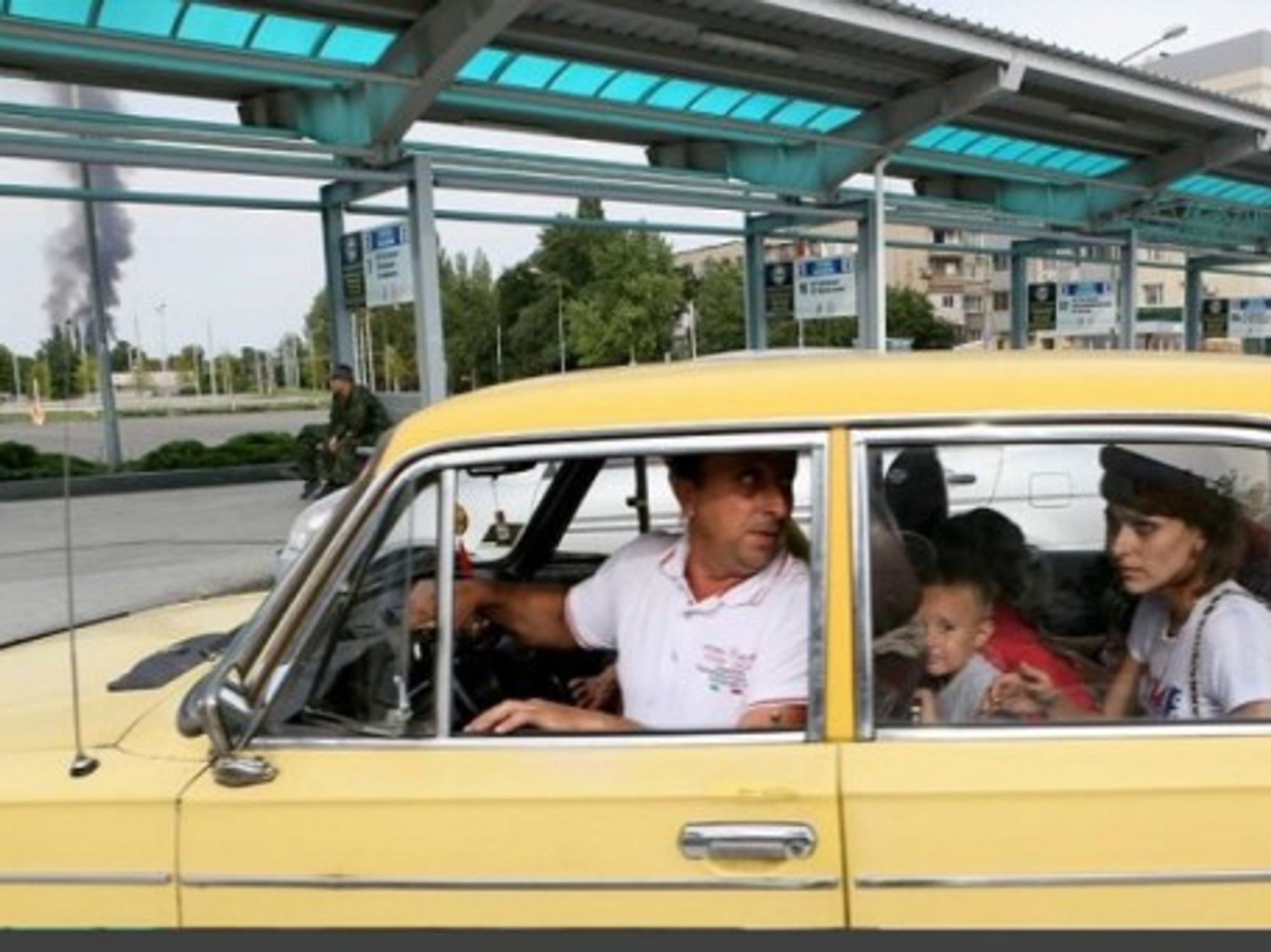 A family flees the Donetsk area as intense fighting continues in the city.