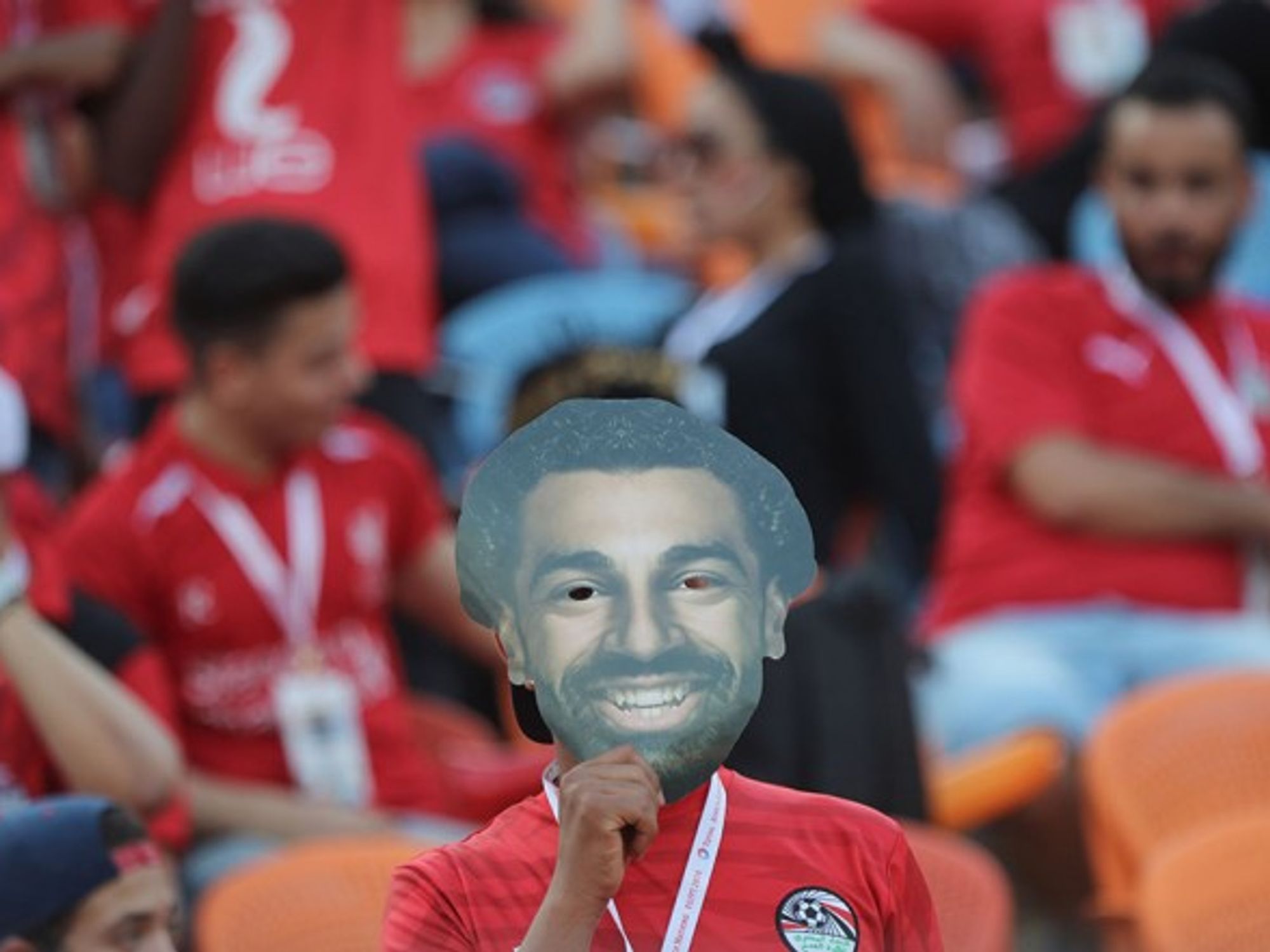 A fan holds the mask of Mohamed Salah in the stands prior to the start of the 2019 Africa Cup of Nations Group