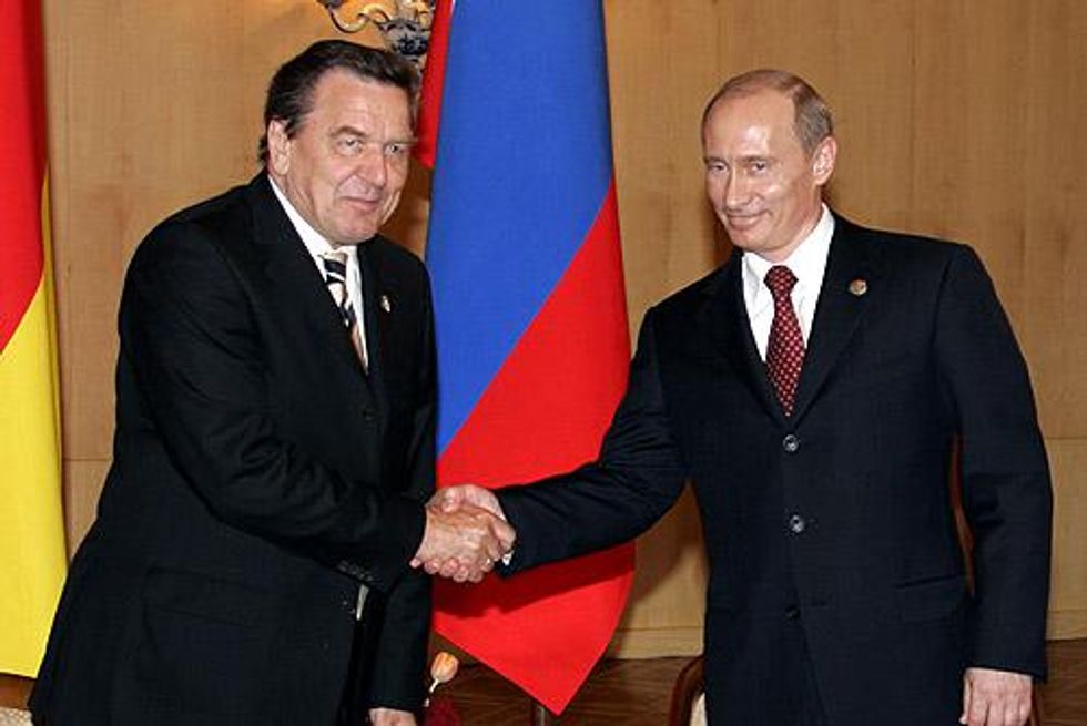 A file photo of former German Chancellor Gerhard Schröder and Vladimir Putin
