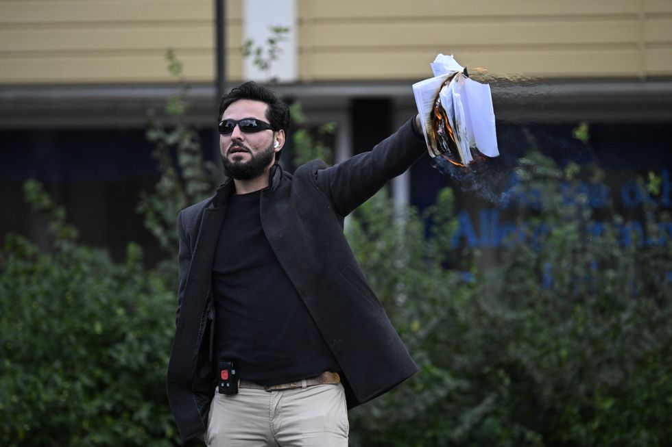 A file picture showing Salwan Momika burning the Quran in Malmüe in the south of Sweden.