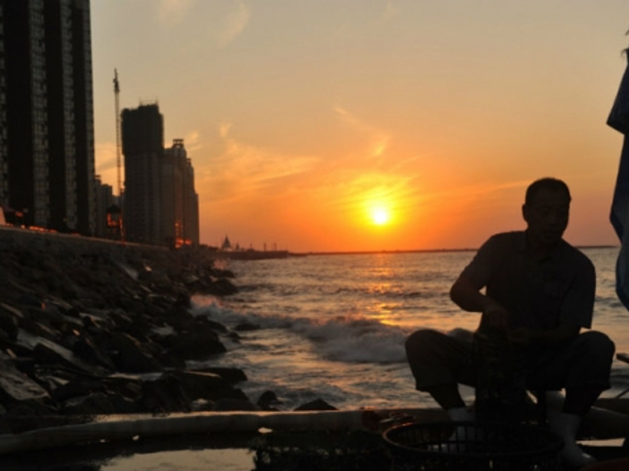 A fisherman at Gangluan port of Longkou city.