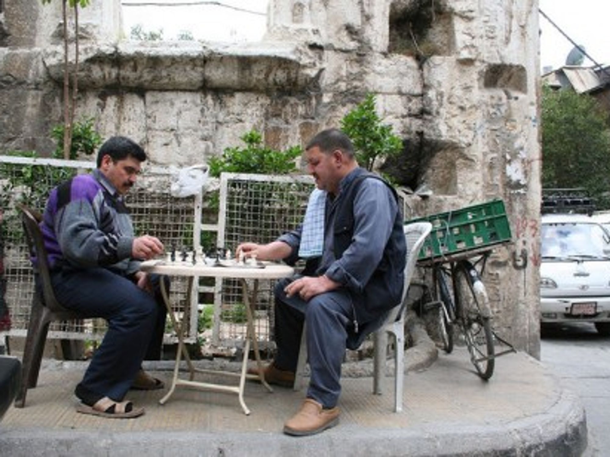 A game of chess near the Roman ruins of Temple of Jupiter in Damascus