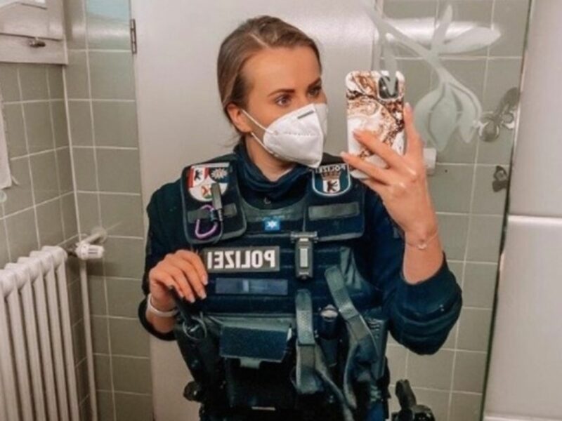 A German police officer taking a selfie.