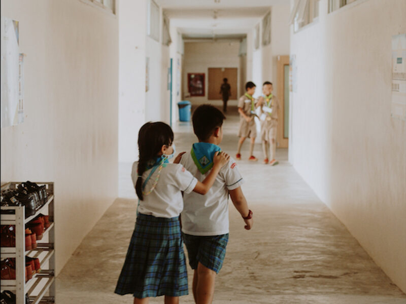 a girl and boy in school uniforms