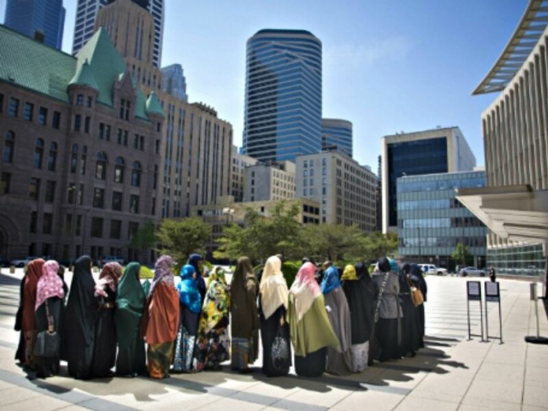 A group of Somali women wait outside Minneapolis' Federal Courthouse
