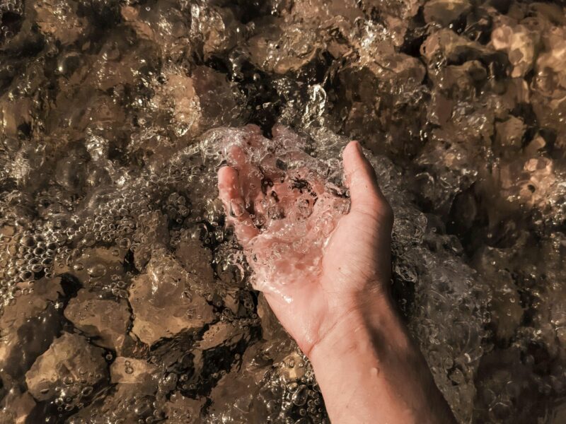 A hand held underwater.