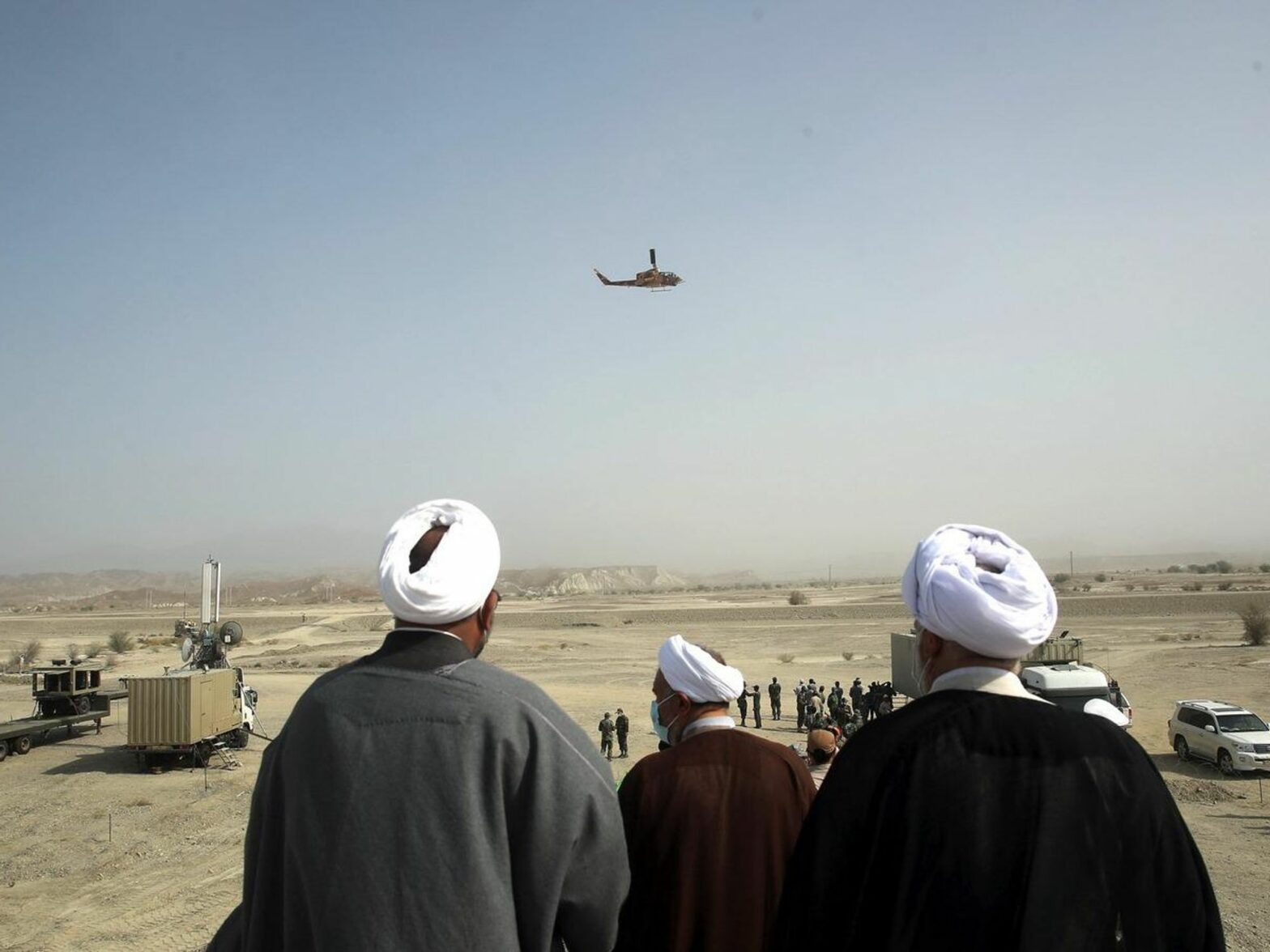 A handout photo made available by the Iranian Army Press Office shows Iranian clerics watching during the second day of a military exercise in Makran sea, south of Iran, 08 November 2021