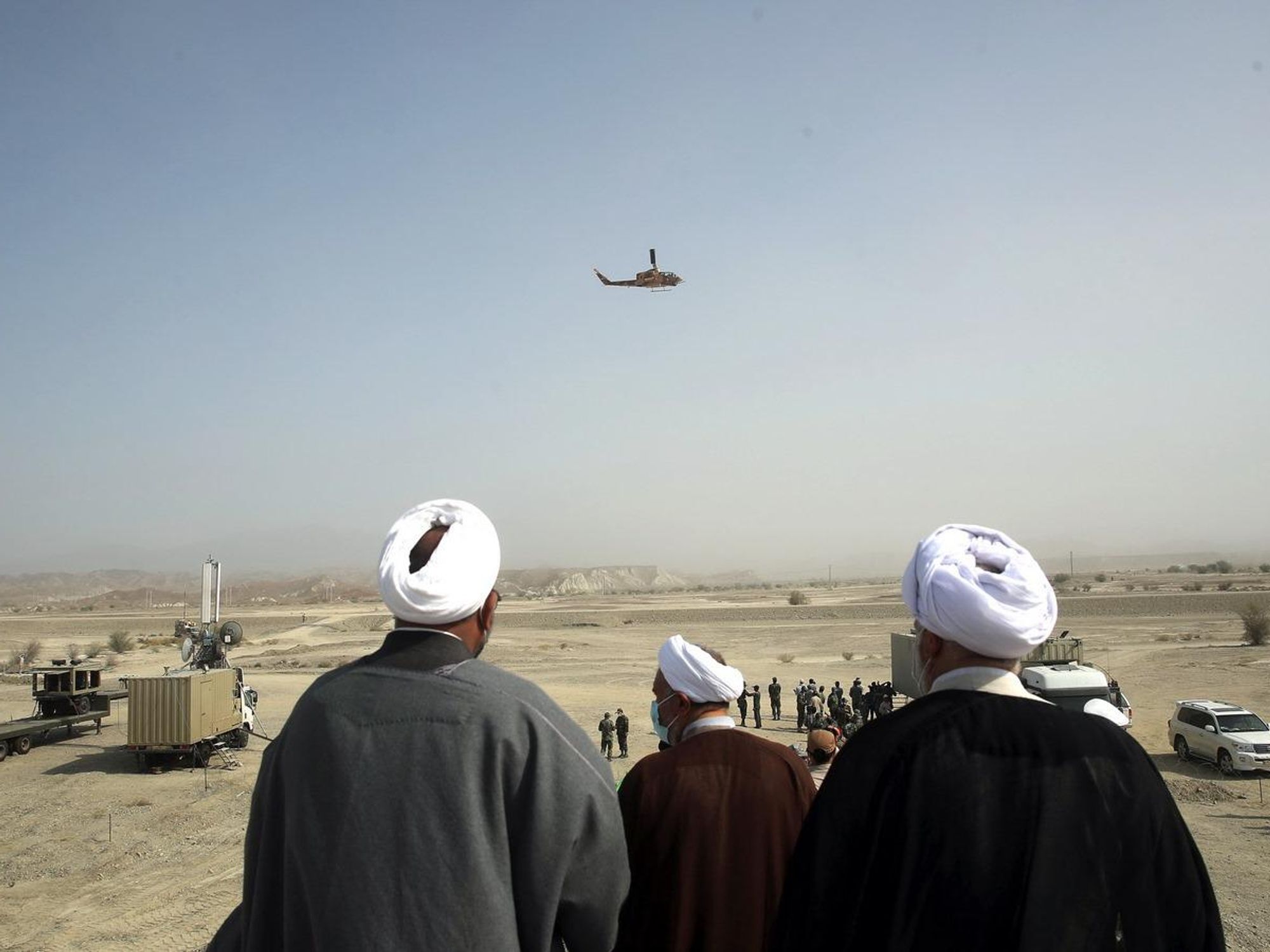 A handout photo made available by the Iranian Army Press Office shows Iranian clerics watching during the second day of a military exercise in Makran sea, south of Iran, 08 November 2021