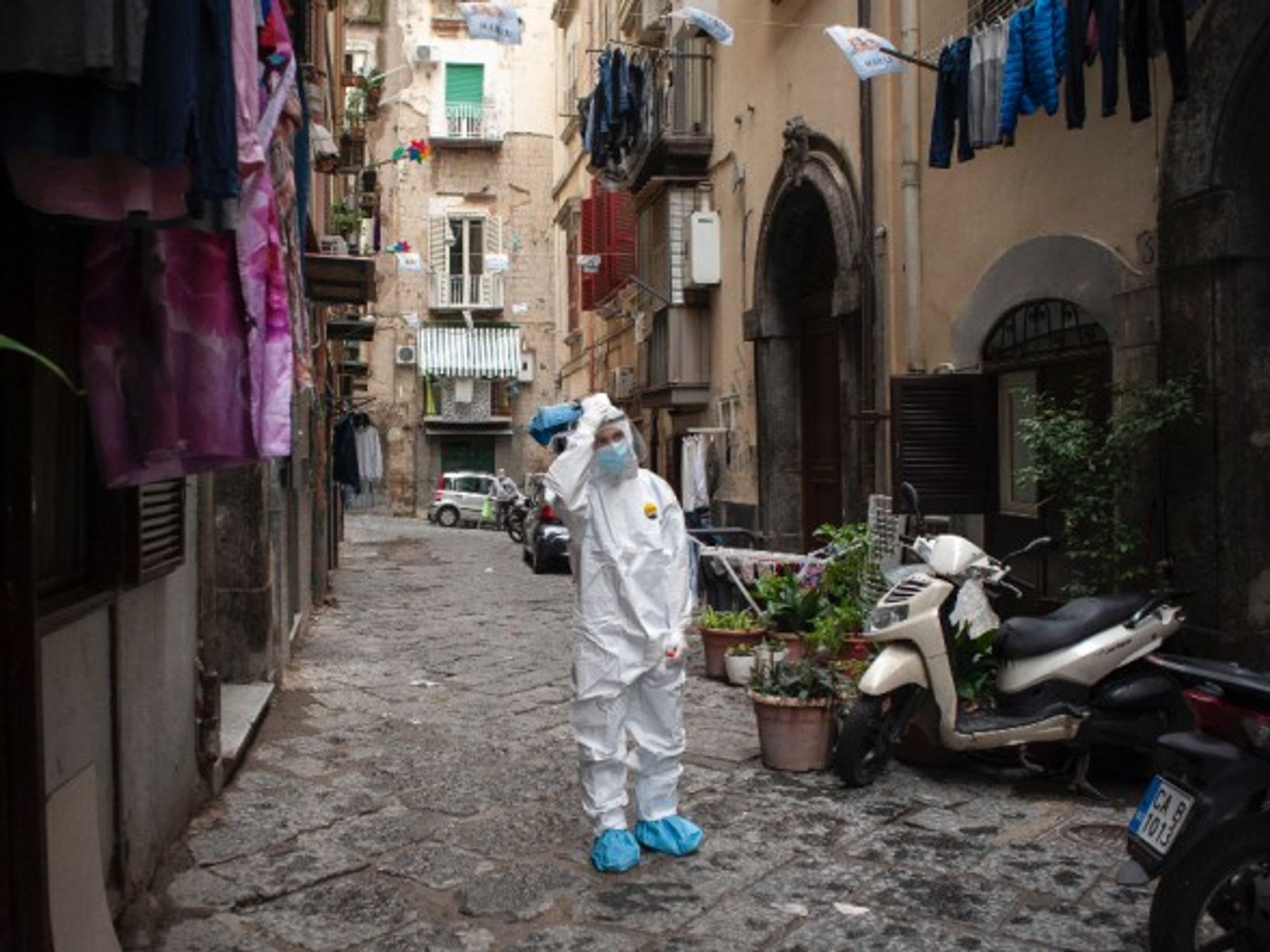 A healthcare worker collecting swab samples in Naples