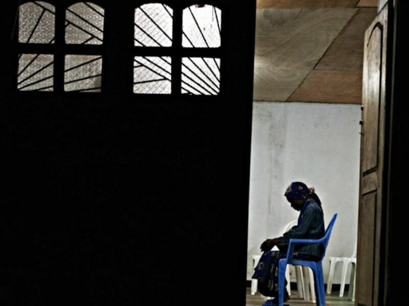 A HIV-positive woman praying for a better life