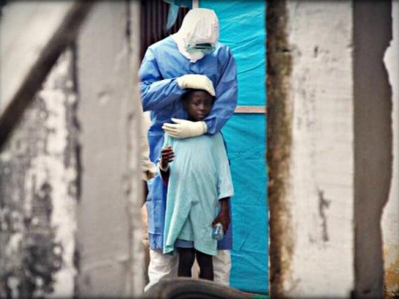 A humanitarian aid worker with an Ebola survivor
