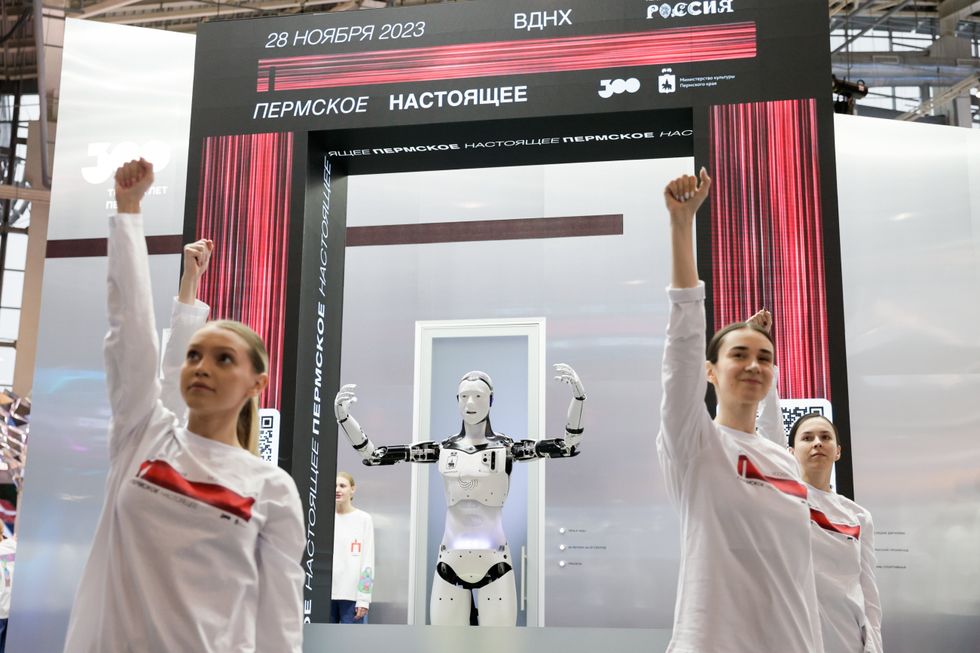 A humanoid robot performs during a flashmob.