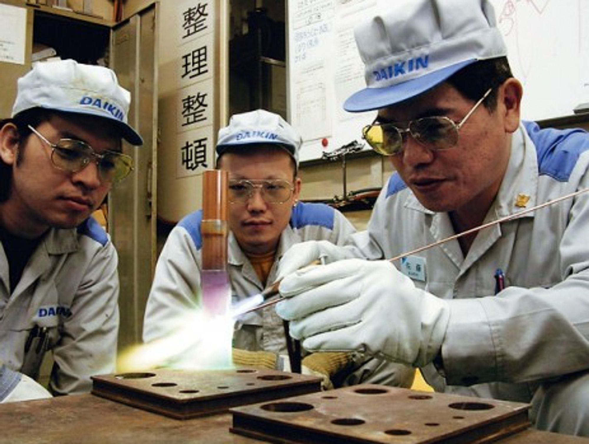 A Japanese "takumi" passing on his knowledge to the next generation.