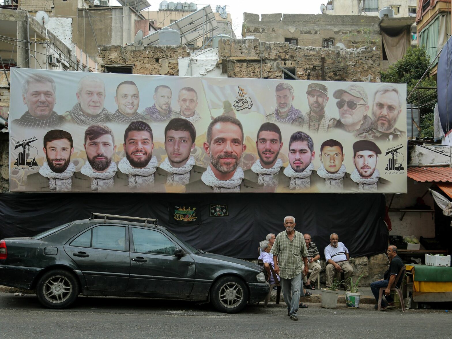 A large poster with the faces pro-Iranian Hezbollah fighters.