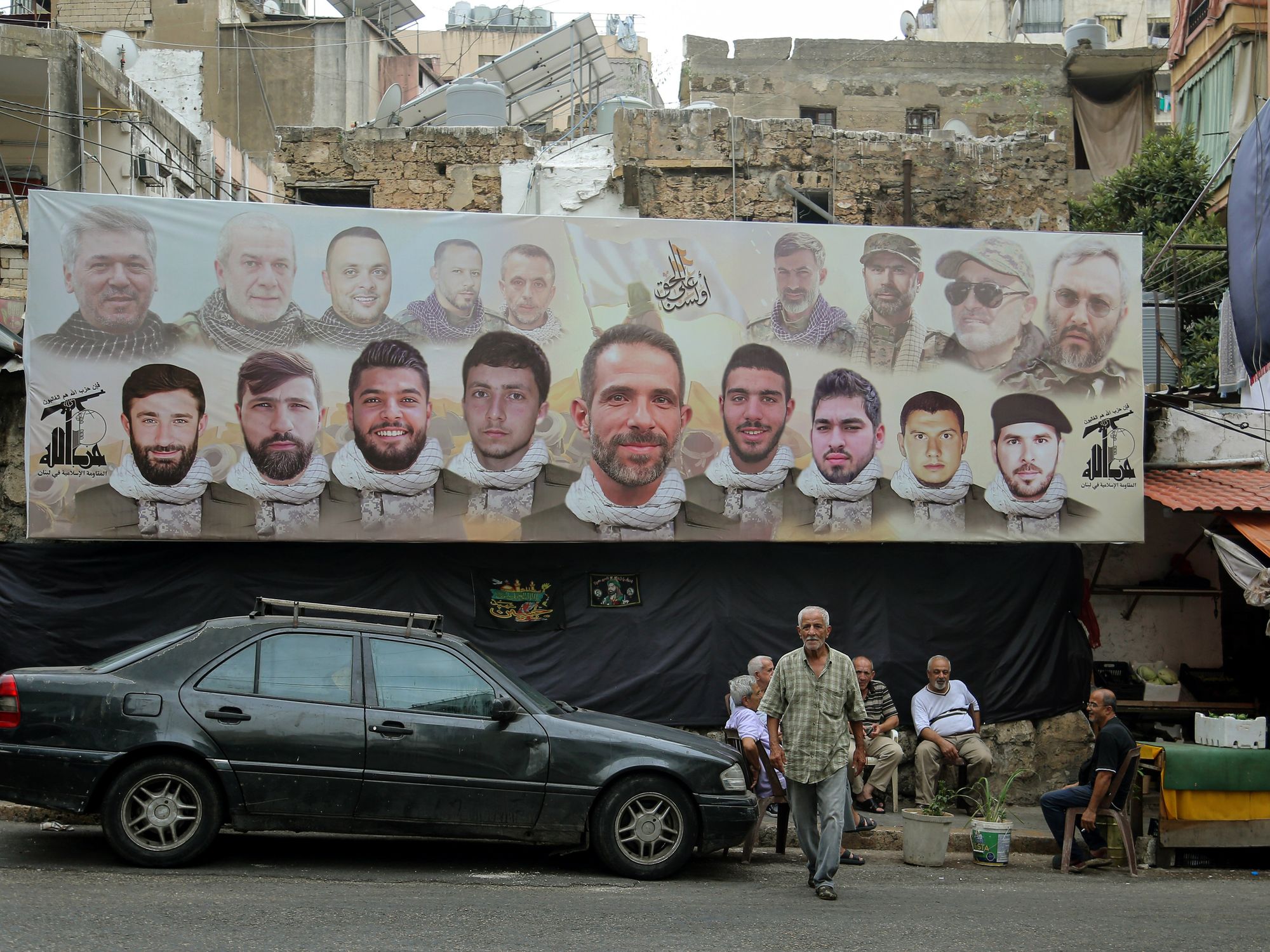 A large poster with the faces pro-Iranian Hezbollah fighters.
