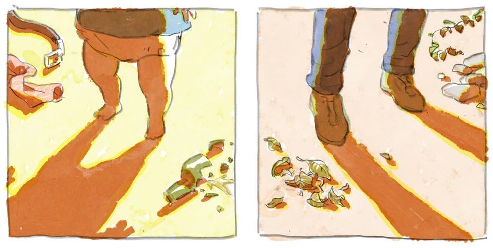 a little boy stand in front of a broken bottle and fallen leaves