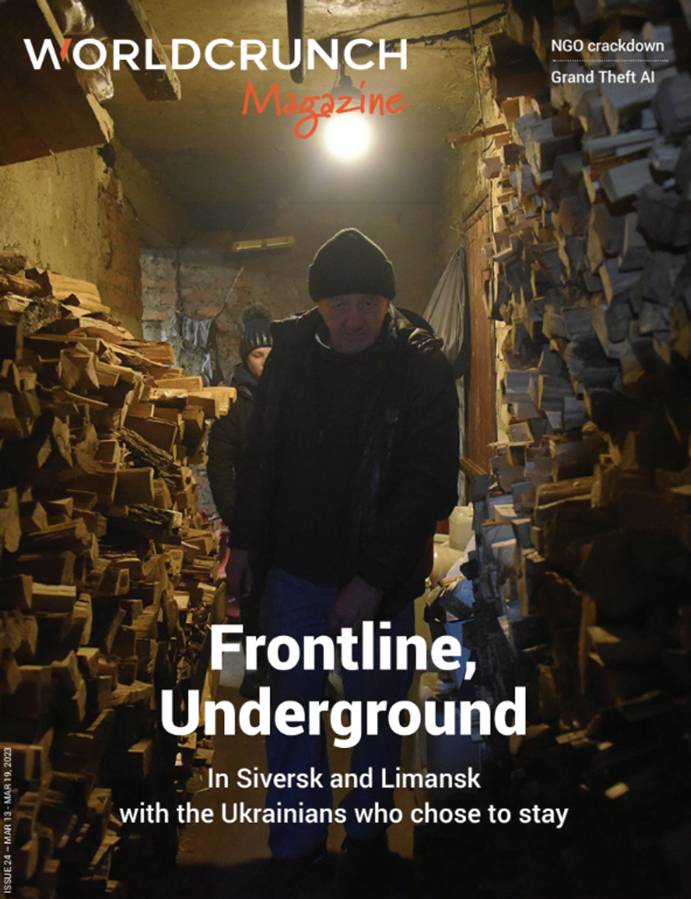 A man and a women in a basement surrounded by a stockpile of wood