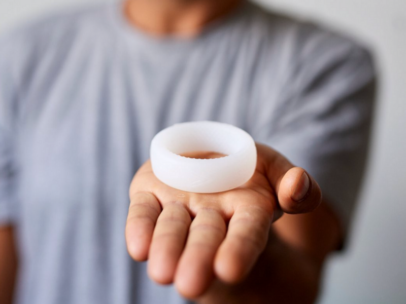 A man holds male contraception device Andro-Switch