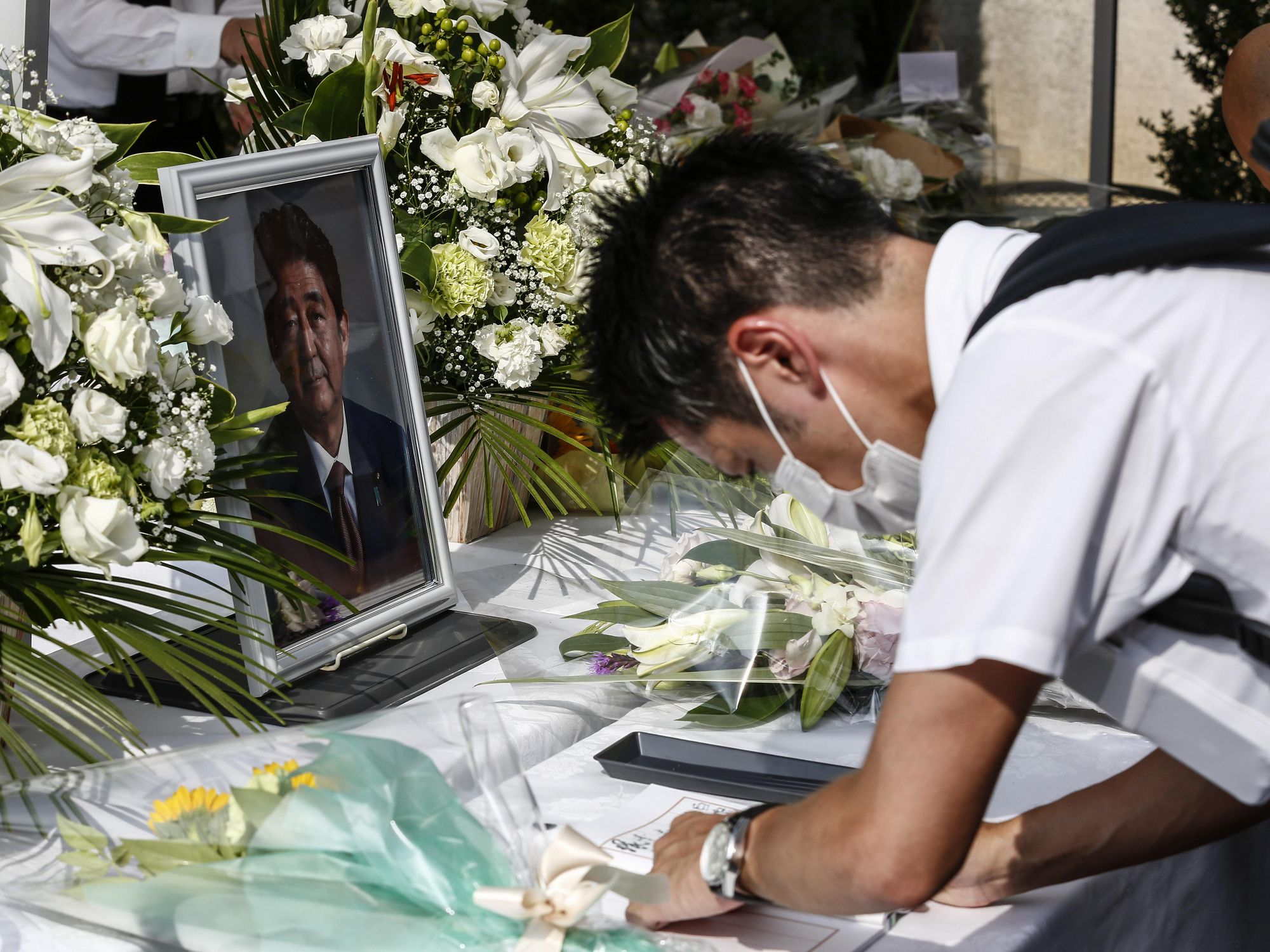 A man mourns former Japanese PM Shinzo Abe.