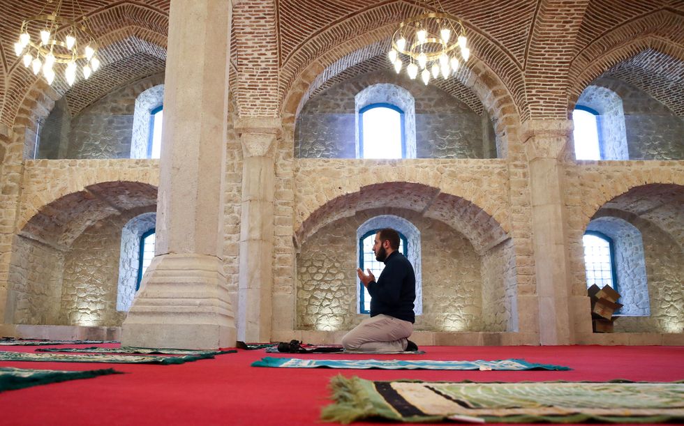 A man praying in the Central Mosque
