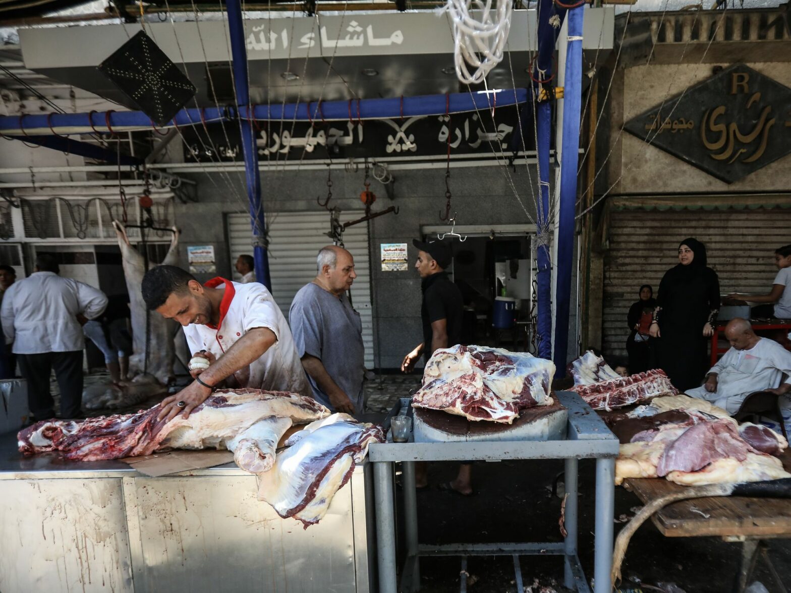A man process the meat of the cattle.