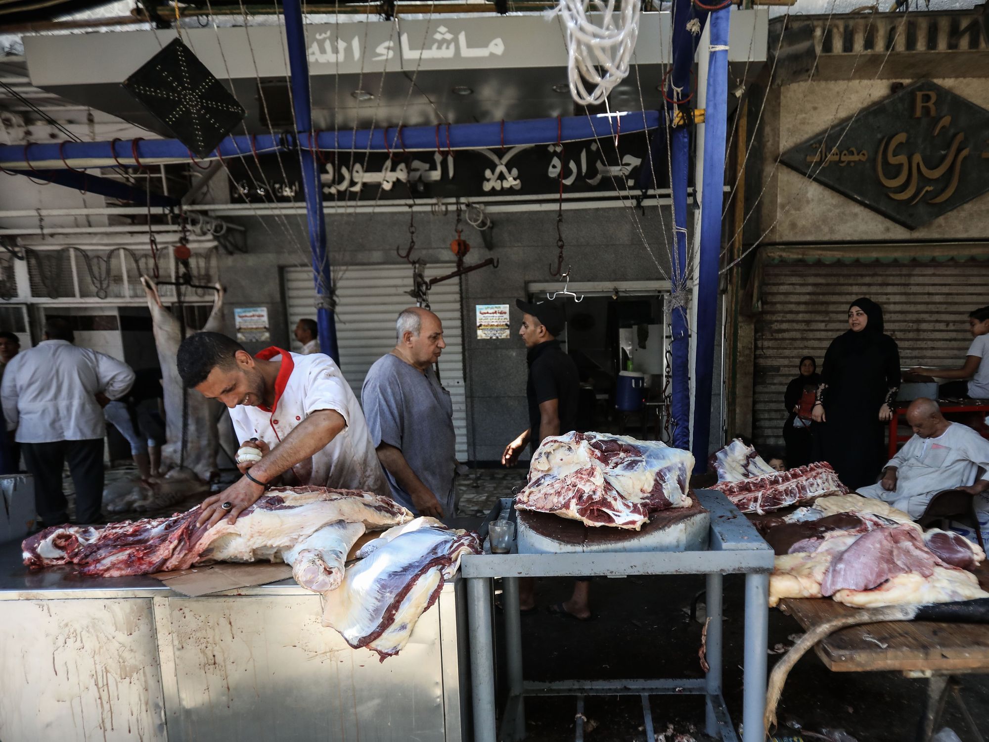 A man process the meat of the cattle.