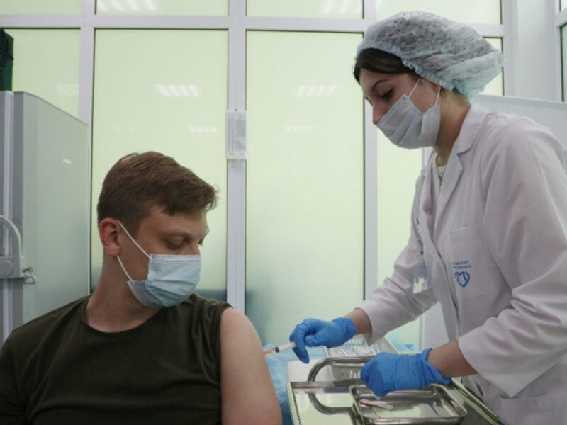 A man receives a COVID-19 vaccine in a Healthy Moscow pavilion