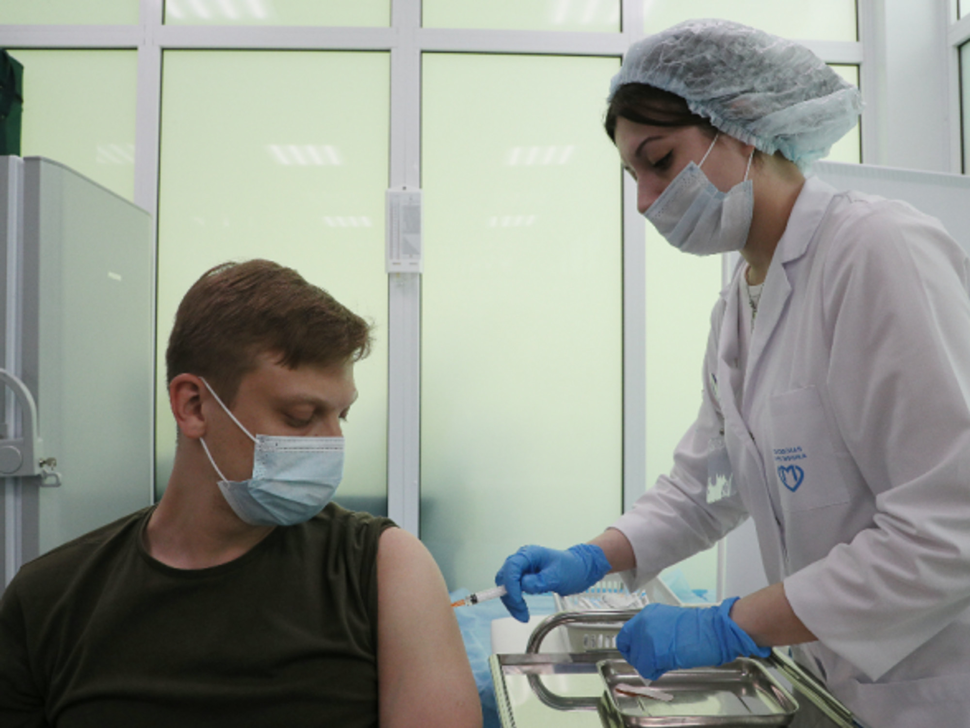 A man receives a COVID-19 vaccine in a Healthy Moscow pavilion