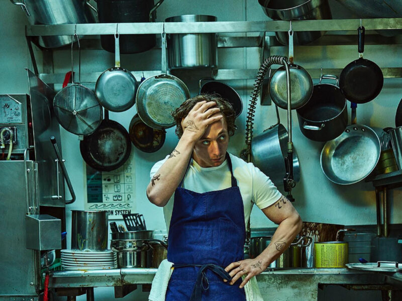 A man standing in a kitchen.