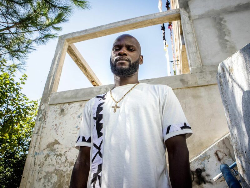 a man standing in front of a building