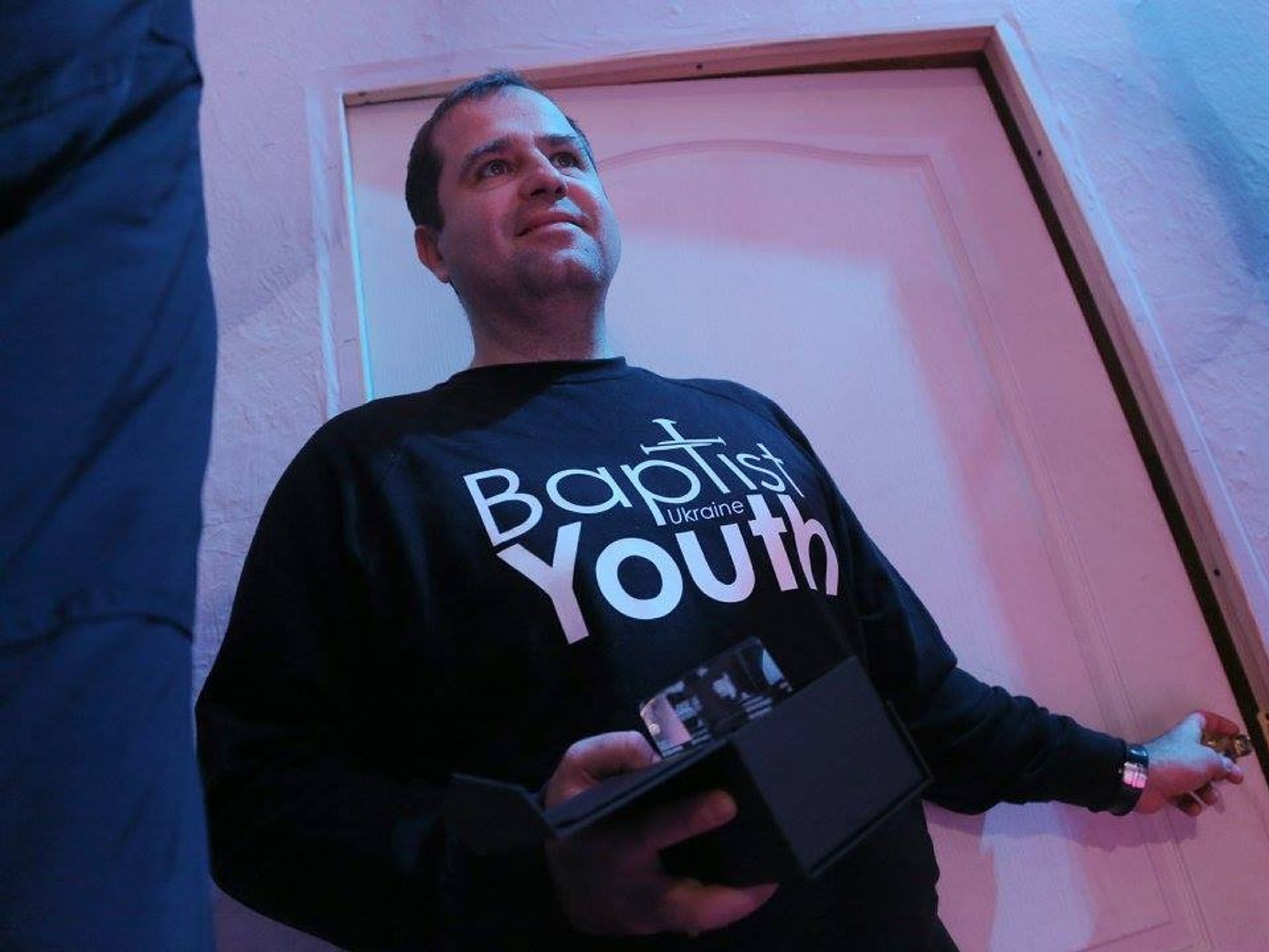 A man wearing an Ukraine Baptist Youth shirt.​