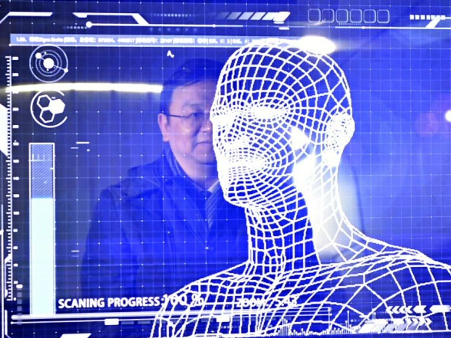 A manager of the BYD company tries the facial recognition in a 'Yungui' train in Yinchuan, China on January 10