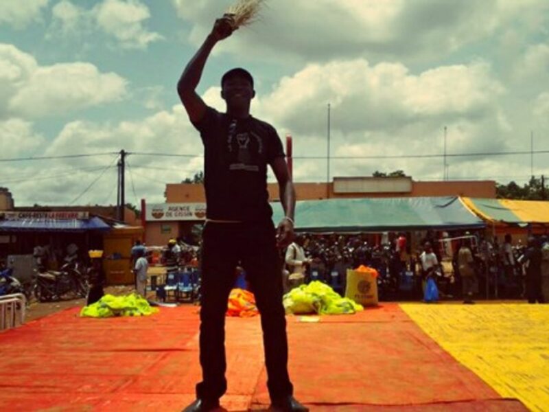 A member of Burkina Faso's "Citizen Broom" group