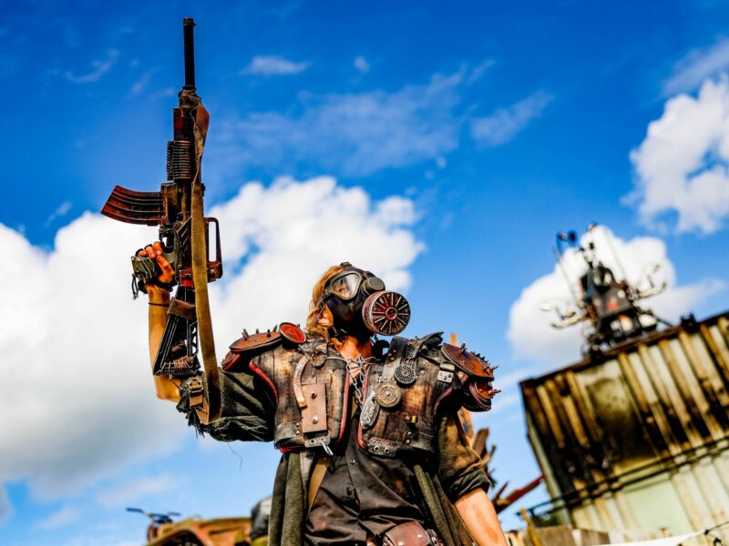 A member of the ''Wasteland Warriors,'' an acting group that has set up a post-apocalyptic scene in a section of the festival grounds at Wacken Open Air that springs from their imagination, celebrates to metal music.