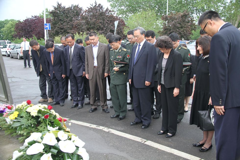 A memorial service at the site of the bombed embassy in Belgrade