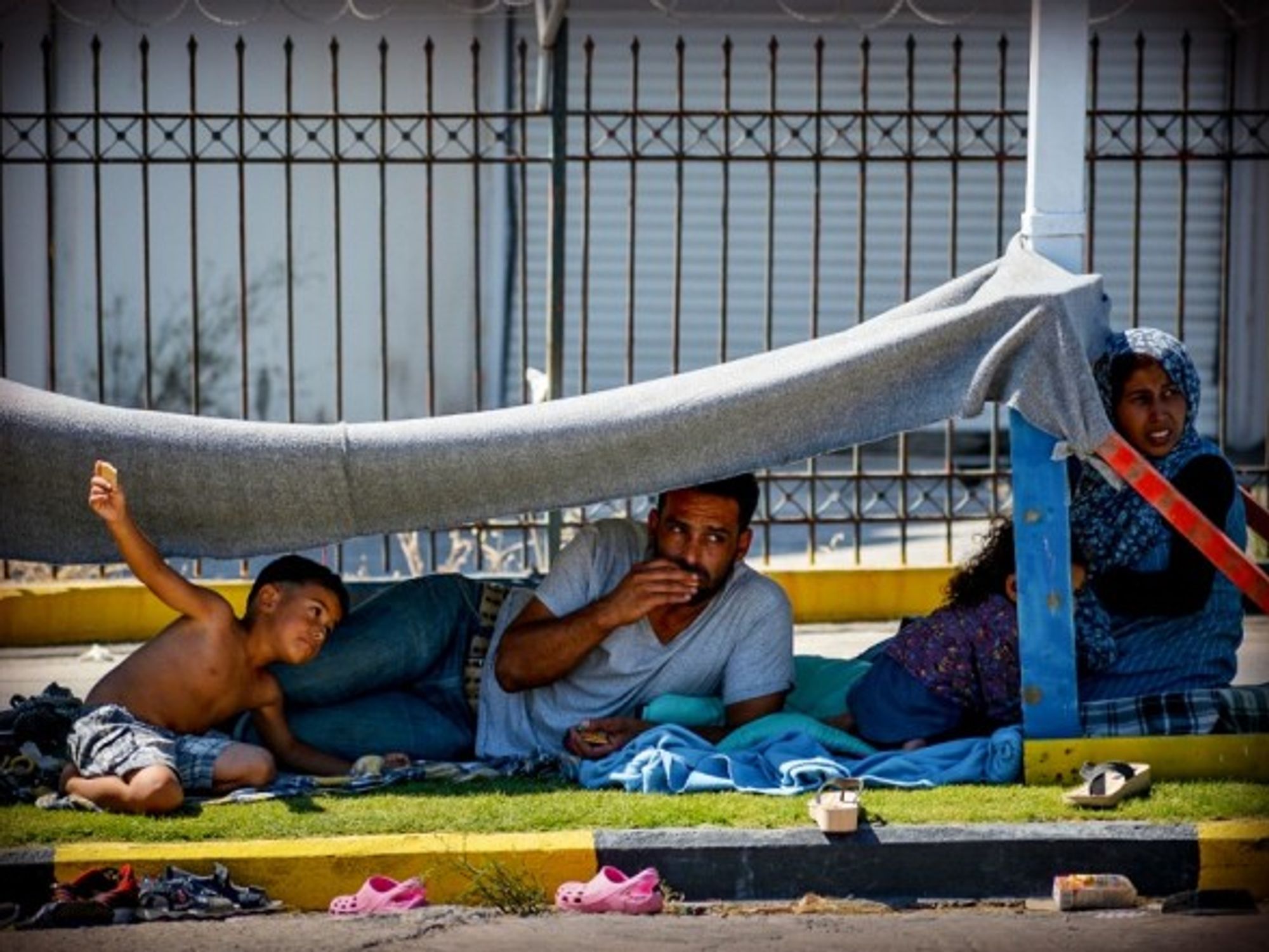 A migrant family left without shelter on the Greek island of Lesbos