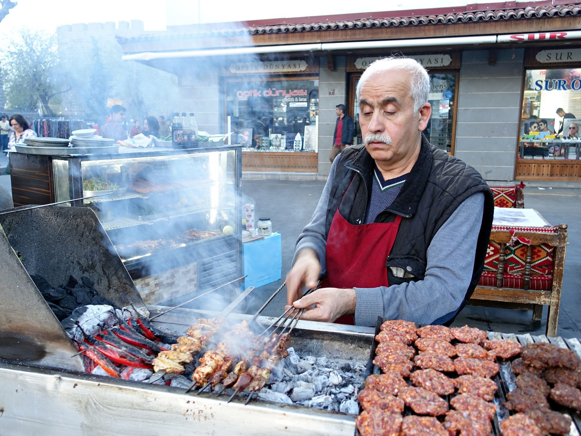 A mobile kebab seller in Diyarbakir is seen roasting kebab varieties and meatballs over the fire.