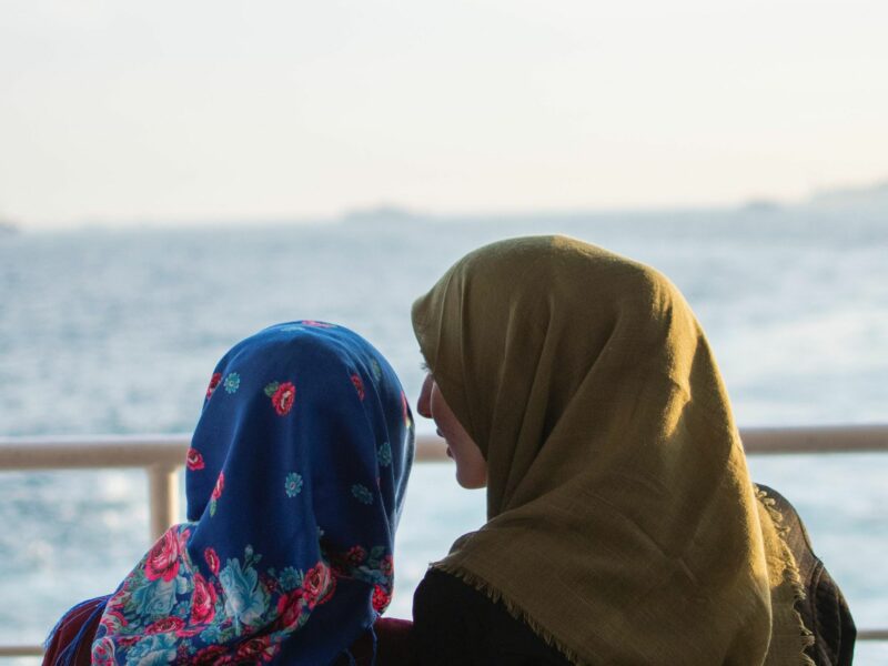 A mother and daughter wearing hijabs.