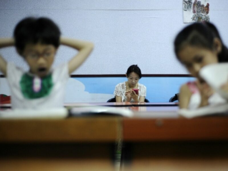 A mother waiting for her children during a music class in Yinchuan