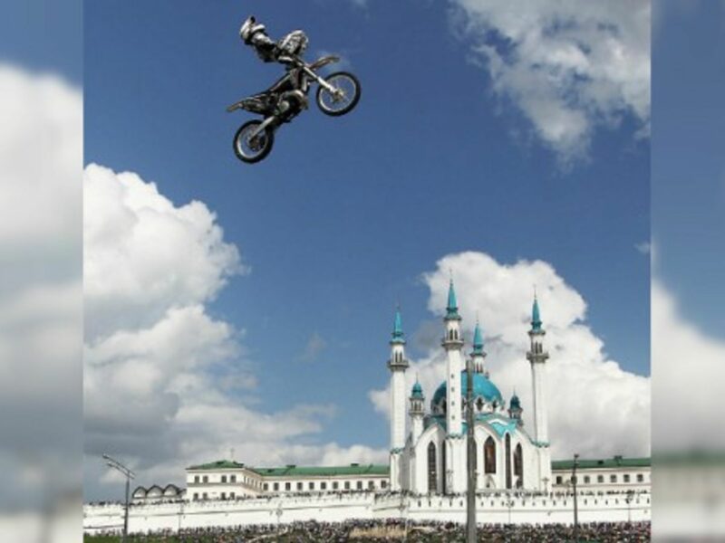 A motorcycle rider soars at the 2014 Kazan City Racing show in Millenium Square in Kazan, Tatarstan.