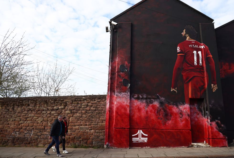 A mural of Mohamed Salah of Liverpool close to the stadium .