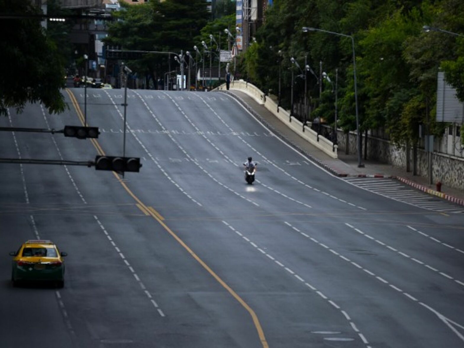 A nearly empty street in Bangkok, Thailand, where a new strict lockdown has been implemented this week to curb the surge in coronavirus cases
