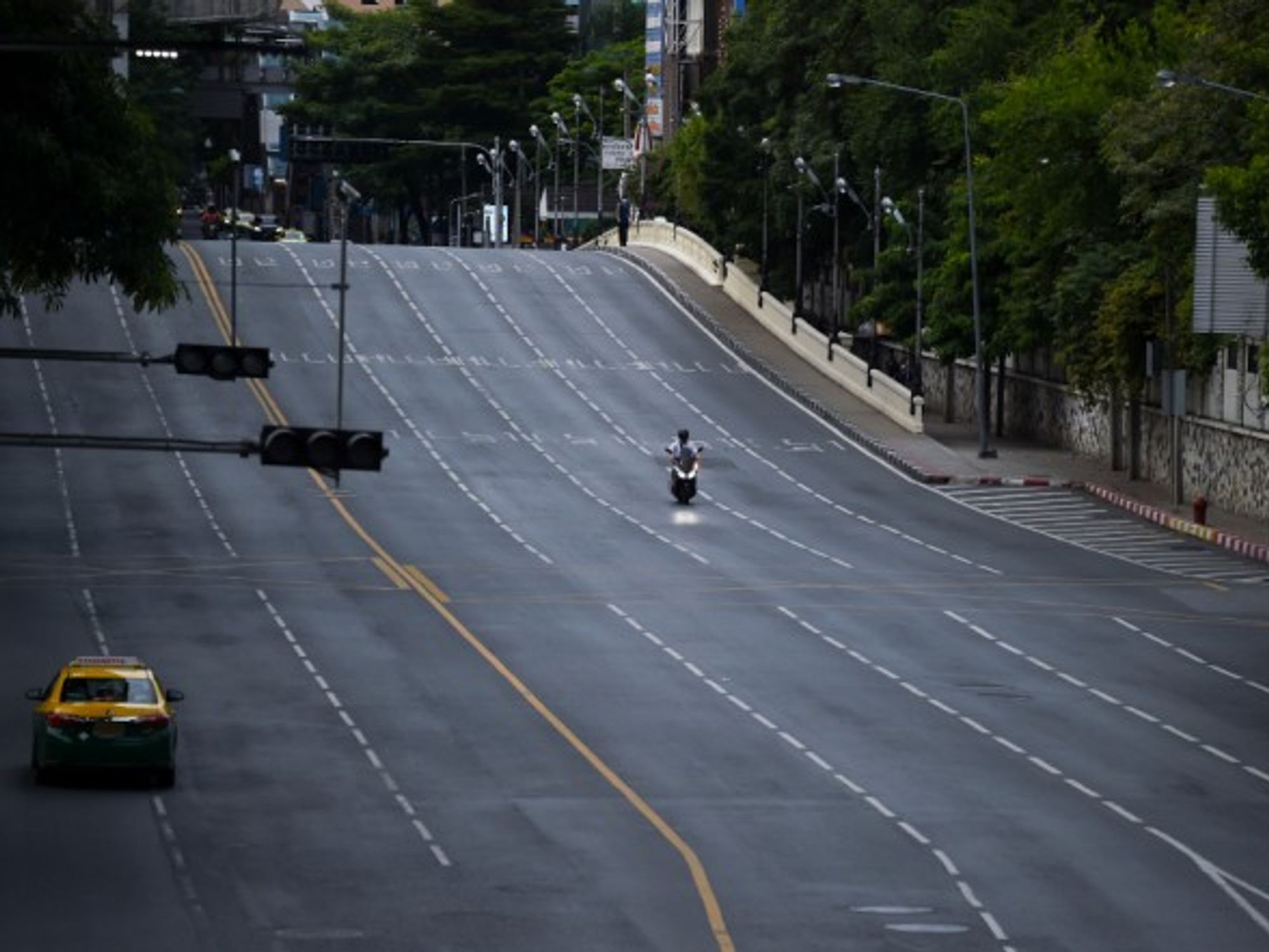 A nearly empty street in Bangkok, Thailand, where a new strict lockdown has been implemented this week to curb the surge in coronavirus cases