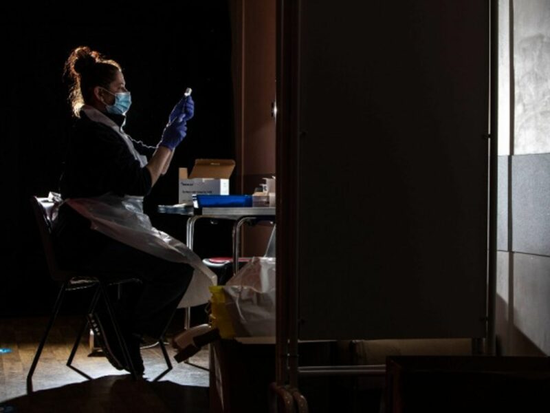 A nurse prepares the COVID-19 Oxford/AstraZeneca vaccine in the UK