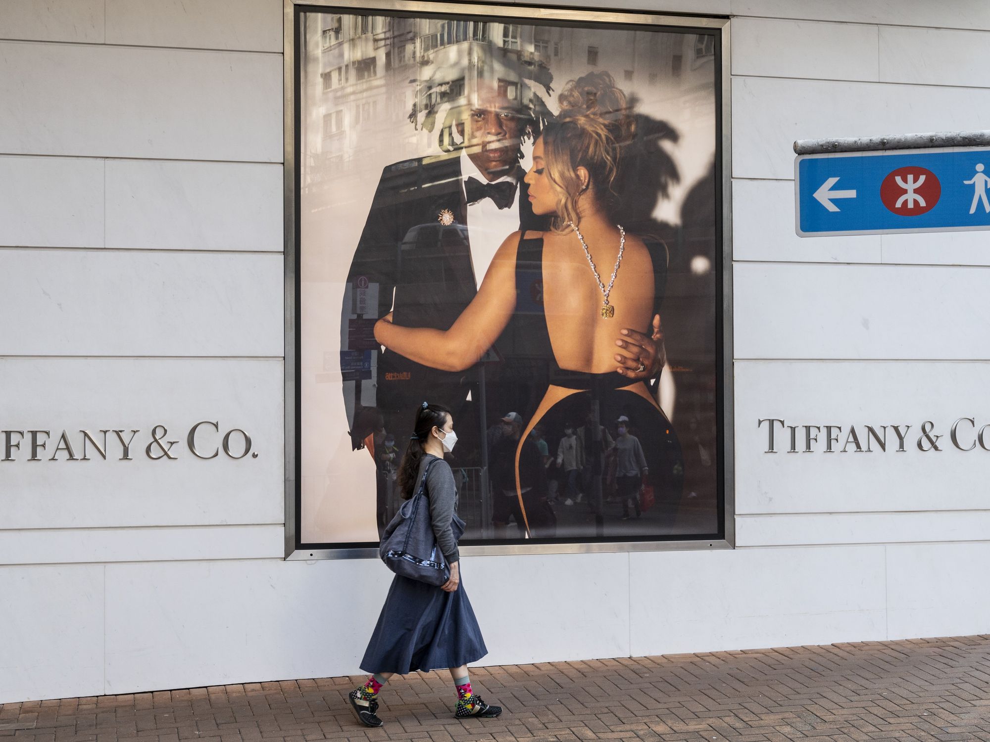 A pedestrian walks past the American luxury jewellery company Tiffany & Co store in Hong Kong.