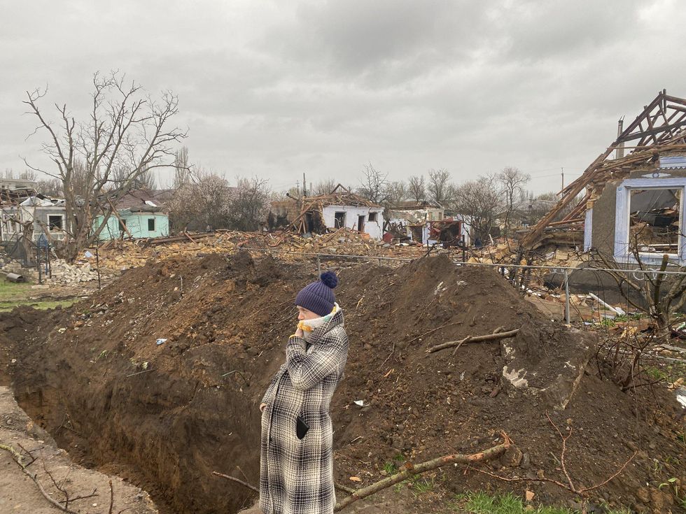 A person stands amid destruction in Mykolaiv, southern Ukraine.