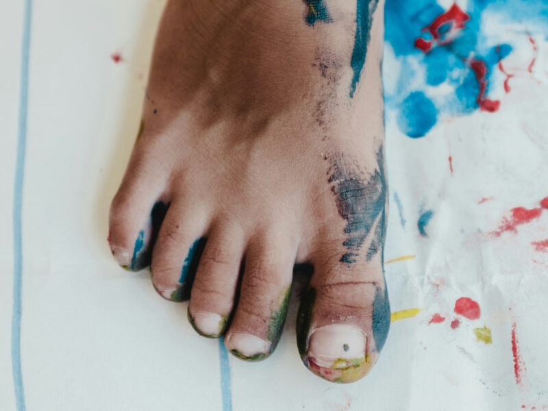 A photo of a child's foot that was dipped in paint placed on a piece of paper to leave an imprint
